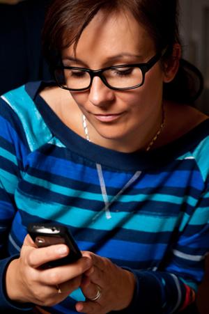 Woman sending text message 